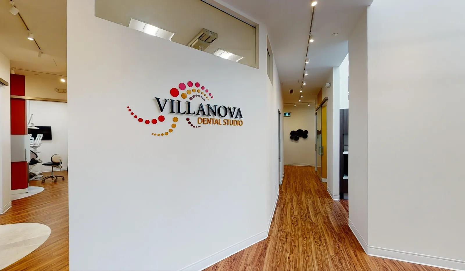 The Main Street office hallway with the Villanova Dental Studio wall logo