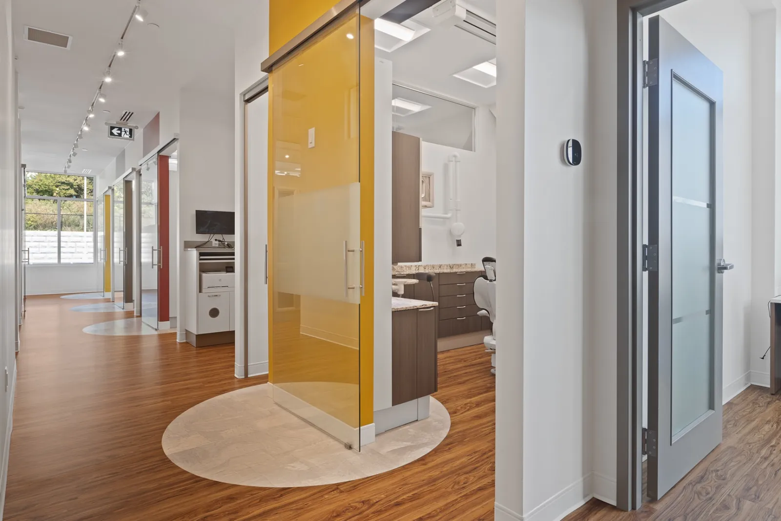 A Terry Fox corridor with a yellow glass sliding door