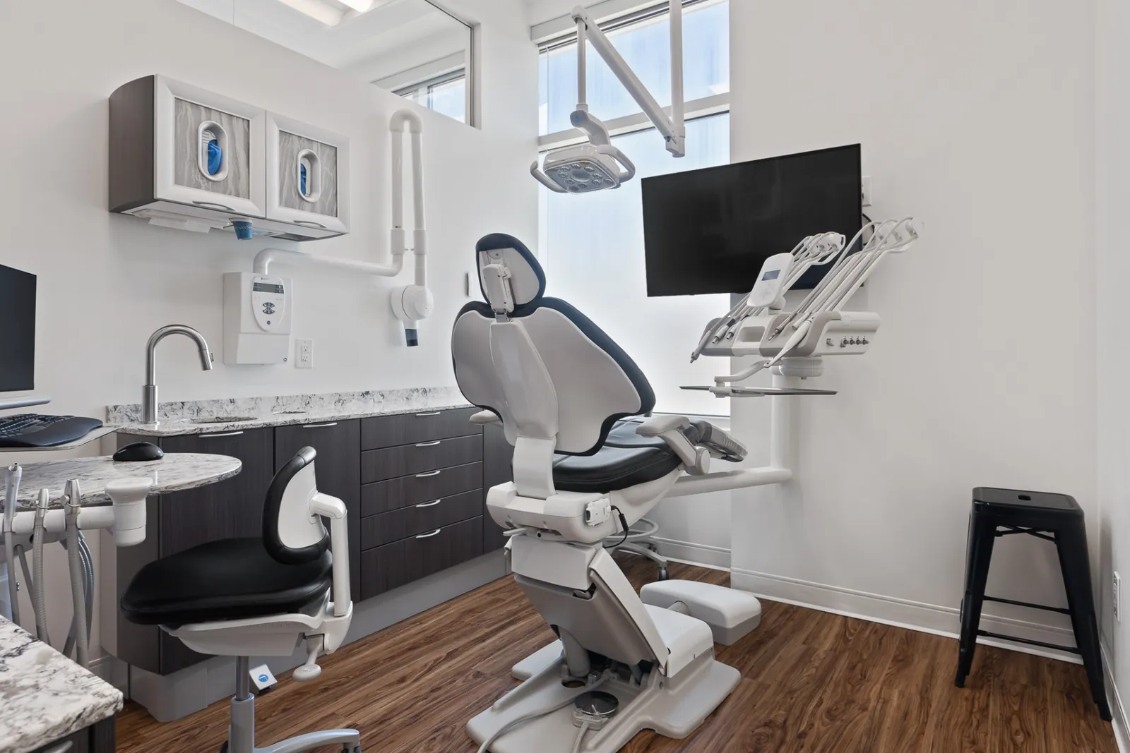 A bright Terry Fox treatment room with a floor-to-ceiling window